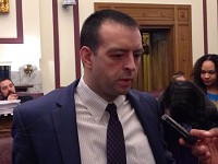 Indiana Office of Management and Budget Director Micah Vincent speaks to reporters Tuesday after he presents GOP Gov. Eric Holcomb's two-year budget proposal to the State Budget Committee. Staff photo by Dan Carden