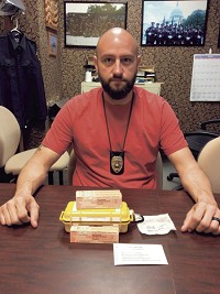 Sgt. Steve Lockard of the Vigo County Drug Task Force shows the naloxone kits now carried by city police officers to reverse the effects of opioid overdose. Staff photo by Lisa Trigg