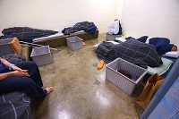 Five inmates are housed in one of the intake cells at the Howard County Jail on June 28, 2018. Staff Photo by Tim Bath