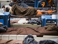 Delaware County Jail inmates, and their belongings, are packed into the jail's recreation room with cots Wednesday morning. The jail was renovated to house 220 inmates, as of Wednesday the jail held 306 inmates supervised by ten jail staff members. A small group of officials spent the morning touring the jail and the possible future site of the jail at the former Wilson Middle School on Tillotson Ave. Staff photo by&nbsp;Jordan Kartholl