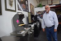 Sandy Sanborn repriced grills this week at Sanborn&rsquo;s For Your Home, 1990 W. Maumee St. The grill on the left cost $4,398.99 Sept. 25. The day before the price tag said $3,999, but Sanborn raised the price after he received several letters from vendors who are increasing their prices because of the tariffs on Chinese imports. Staff photo by Lisa Esquivel Long