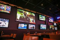 Tickers give sports information at Michigan City's Blue Chip Casino's The Game sports bar. The tickers also display news and betting odds. Staff photo by John J. Watkins