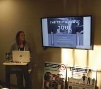 Sarah Null shows a slide on the dangers of smoking electronics cigarette. Staff photo by Phil Herrold