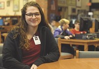 It is not the money: Indiana State University junior Kimberly Schneider says a career in education is about more than the pay and enjoys seeing students grow as they learn. She is a part-time substitute teacher for Vigo Couty School Corp. and is seen here on Wednesday in the Sarah Scott Middle school media center. Staff photo by Joseph C. Garza