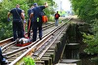 Kokomo police and fire along with medics respond to three people found unconscious by the Wildcat Creek under the railroad bridge behind Future Park on October 10, 2017. One person was able to walk up the hill on their own the other two had to be carried then taken to the hospital. They were both conscious but not too responsive. Staff photo by Tim Bath