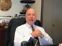 House Speaker Brian Bosma, R-Indianapolis, speaks to reporters earlier this year in his Statehouse office. On Thursday, Bosma said the recent availability of an "X" gender option on Bureau of Motor Vehicles credentials has complicated Republican Gov. Eric Holcomb's push for a comprehensive bias crime statute. Staff photo by Dan Carden