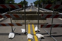 Foot traffic has also effectively been blocked after a locked gate was added across the width of the New Harmony Bridge. The bridge spans the Wabash River from New Harmony to White County, Ill. Staff photo by Denny Simmons
