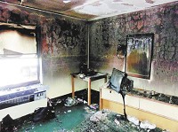 A Days Inn hotel room is charred after an explosion and fire in this submitted file photo from 2012.