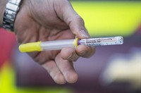 A South Bend Fire Department paramedic displays a syringe and vial of naloxone, a drug that can reverse life-threatening heroin overdoses. Local police departments are considering plans to equip officers with the drug to fight an epidemic of deadly overdoses. SBT Photo/ROBERT FRANKLIN