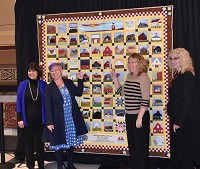 From left, Indiana First Lady and Bicentennial Ambassador Karen Pence, quilt project coordinator Joy William, Hendricks County Square maker Amanda Castor and Indiana Barn Foundation President Carolyn Rahe at the quilt's unveiling in Indianapolis in February, 2016. Albert William photo