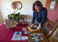 Dana Dyczkos looks through old photos of her son, Adams, who died March 7 of a heroin overdose, inside her Niles home on Wednesday, March 22, 2017. Staff photo by Robert Franklin