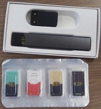 A Juul device along with four pods. Staff photo by Phil Herrold