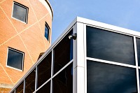 Cameras at school entrance monitors traffic in and out of the building. Tinted and/or reinforced windows are also utilized by schools on exterior walls. Staff photo by Tyler Stewart