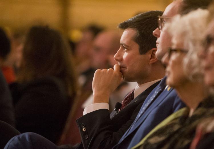 South Bend Mayor Pete Buttigieg looks on as local high school choirs perform before his final State of the City address March 12 inside the Morris Performing Arts Center in South Bend. Tribune Photo/ROBERT FRANKLIN 