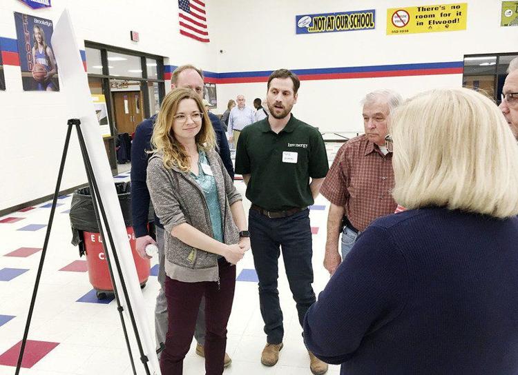 Invenergy officials explain the proposed 700-acre solar farm to area residents Wednesday at Elwood Jr./Sr. High School. Katya Samoteskul of Invenergy says the division within the community is common wherever the company has proposed solar farms. “We want to have a conversation with residents and answer their questions,” she said. “We want to hear their concerns.” Staff photo by Ken de la Bastide
