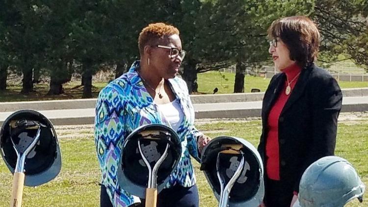 Gary Mayor Karen Freeman-Wilson, left, talks with Jeannette P. Tamayo, regional director of the Economic Development Administration in Chicago, about plans for a $7.9 million two-land Buffington Harbor access road on Tuesday. (Carole Carlson/Post-Tribune)
