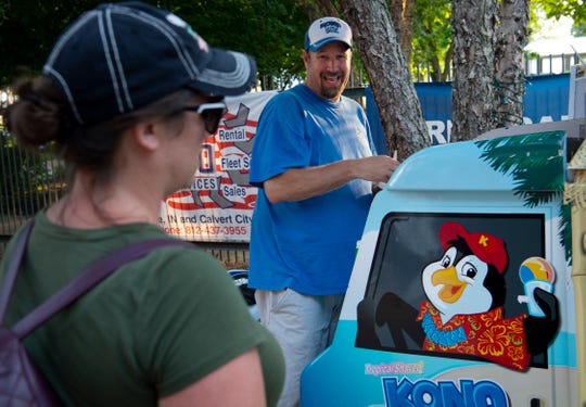 Brian Smith, a Bend Gate Elementary School teacher, serves up Kona Ice 40 hours each week for a summer job to help supplement his family's income. Smith works 15-25 hours each week for part of the school year. (Photo: DENNY SIMMONS / COURIER & PRESS)