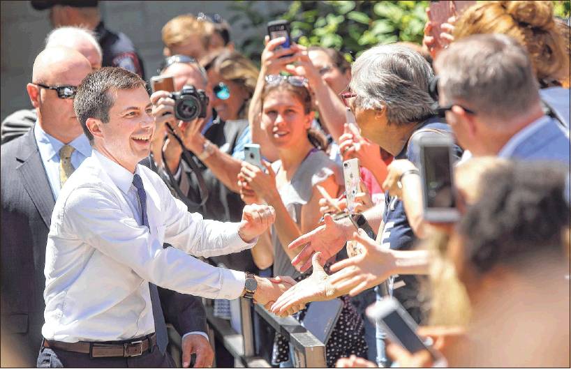 Democratic presidential hopeful Pete Buttigieg shakes the hands of supporters Tuesday outside the Indiana University Auditorium. (Rich Janzaruk / Herald-Times)