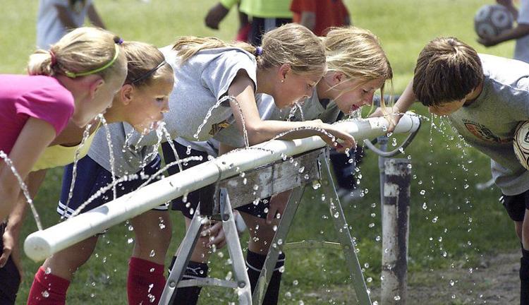 Participants in the Anderson Soccer Camp take a break to hydrate back up during their afternoon session at Anderson University. Reports show the worst-case scenarios for Indiana's future climate include predictions that more droughts will occur in the summer and temperatures will rise. CNHI Indiana News photo by John P. Cleary