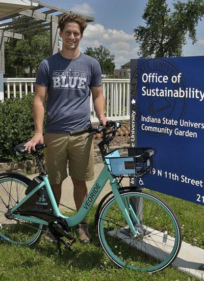 Healthy, with no emissions: Nick McCreary, sustainability coordinator at Indiana State University, displays on Wednesday a VeoRide, which will be the bike of the university’s new bikeshare program. The program got a test run in the spring and will be fully launched for the fall semester.  Staff photo by Joseph C. Garza