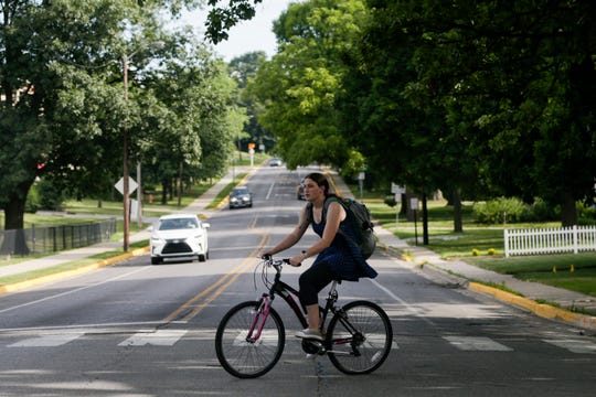 A bicyclist rides along Grant st., Wednesday, July 3, 2019 in West Lafayette. (Photo: Nikos Frazier | Journal & Courier)