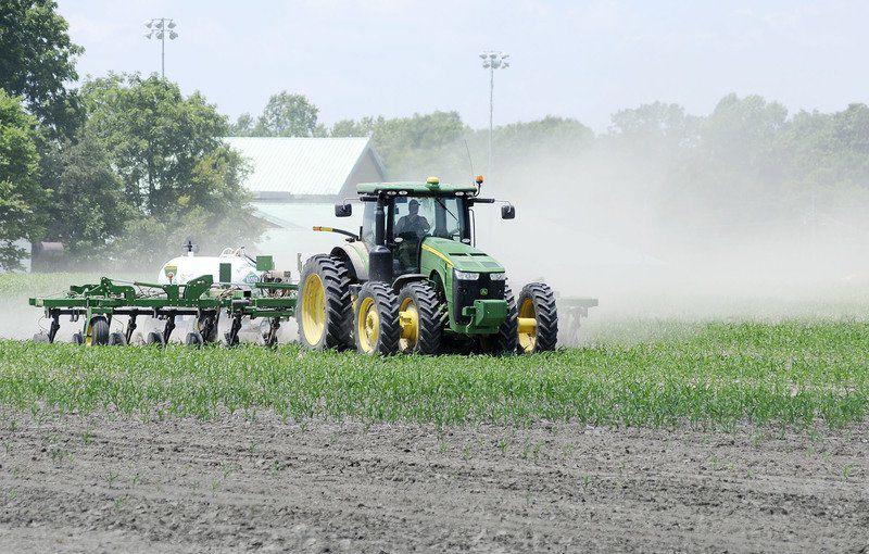 A farmer fertilizes corn in a field off Lindberg Road near Eastside Elementary School in Anderson on Thursday. Photo by Don Knight | The Herald Bulletin
