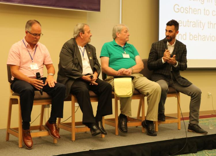 Mayors, from left, Phil Jenkins of Nappanee, Richard Hickman of Angola, Dave Kitchell of Logansport and Jeremy Stutsman of Goshen participate in a Mayor’s Roundtable during the fourth annual Indiana Climate Leadership Summit at Goshen College Thursday afternoon. 
John Kline | The Goshen News