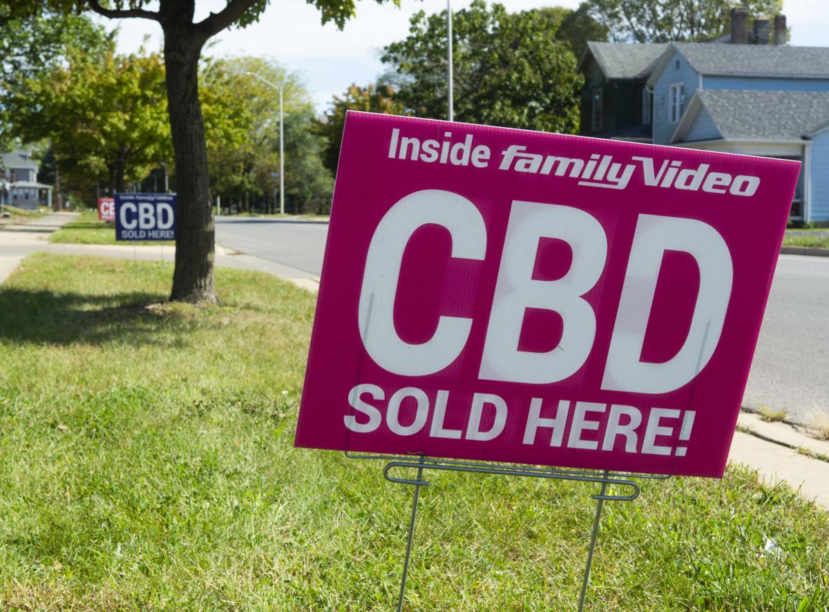 Signs announce the availability of CBD products at Family Video at 318 12th St..Logansport. Staff photo by Kevin Burkett