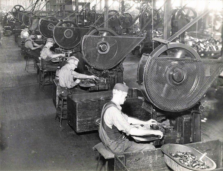 Press operators at Columbian Enameling and Stamping in Terre Haute make kitchenware products in the early 20th century. Courtesy Vigo County Public Library/Vigo County Historical Society