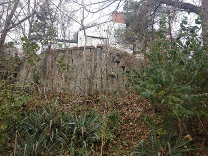 This photo of a crumbling wall behind an Ogden Dunes home can help illustrate the crumbling foundation of trust and communication between some residents and town officials. (Provided by Mike Falk / HANDOUT)