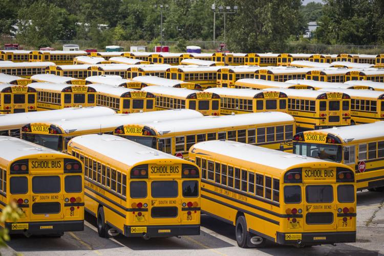 School buses sit in a lot at the South Bend Community School Corp.’s transportation department in a Tribune file photo. The system is bracing to ask school district voters to approve a $74.8 million referendum in the spring. Without it, cuts will need to be made to the school’s operations. South Ben Tribune File Photo/MICHAEL CATERINA