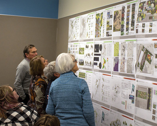 A group of Connersville residents view drawings of ideas for the city’s downtown by landscape architecture students at Purdue last Friday. Provided image