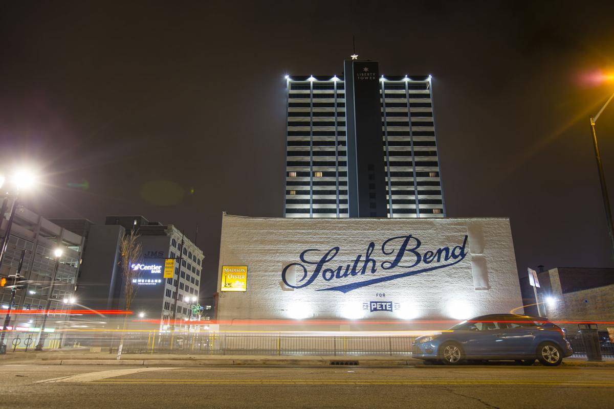 Cars drive on Colfax Avenue by a “South Bend for Pete 2020” mural painted on the side of the Madison Oyster Bar Friday in downtown South Bend. Staff photo by Michael Caterina