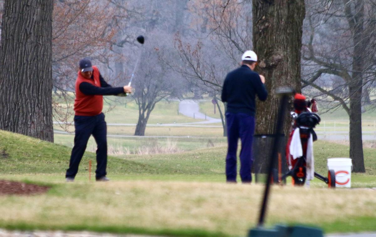 Golfers could be seen Thursday morning at the Innsbrook Country Club in Merrillville. Despite his stay-at-home order, Gov. Eric Holcomb has granted golf course owners the ability to stay open during the COVID-19 outbreak. Staff photo by Marc  Chase
