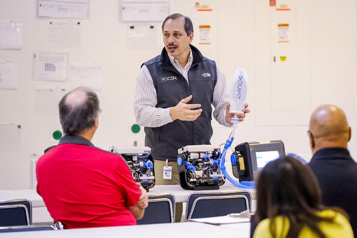 Ventec Life Systems Vice President Engineering Joe Cipollone explains its VOCSN critical care ventilator Friday, March 27, 2020, to General Motors employees who will be helping to produce the ventilators at the GM Kokomo, Indiana manufacturing facility, in response to the COVID-19 pandemic. The FDA-cleared ventilators are scheduled to ship as soon as next month. Photo by AJ Mast for General Motors
