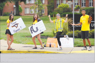 From left, Elli Brooks, Claire Gabel, Megan Moran and Malik Laffoon welcome new students to campus on move-in day at Anderson University last August. University officials are making plans to reopen the campus to in-person classes by the scheduled mid-August start date. File photo