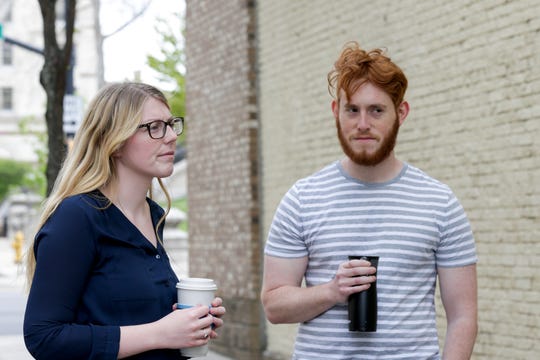 Emily Stillman, left, talks about mask wearing, as she and Thomas Ilyevsky walk down Main Street, Thursday, May 7, 2020 in Lafayette. (Photo: Nikos Frazier | Journal & Courier)