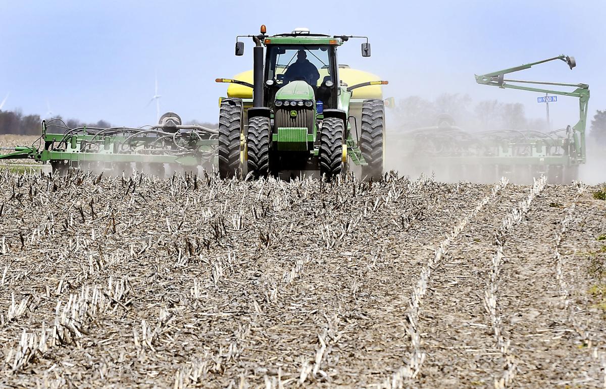 A farmer plants a no-till field along County Road 750 West near Frankton recently. Area farmers are ahead of schedule in getting their crops in the ground this spring. Staff photo by John P. Cleary