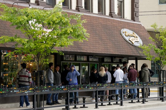 Customers line up outside Harry's Chocolate Shop on State Street, Monday, May 11, 2020 in West Lafayette. (Photo: Nikos Frazier | Journal & Courier)