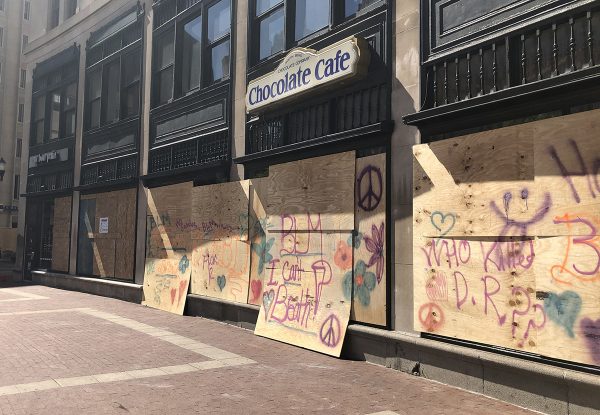 South Bend Chocolate Co. on Monument Circle was boarded up on Monday, like most street-level businesses in the area. (IBJ photo/John Russell)