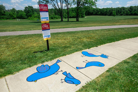 Different paintings complement each sign along the new Born Learning Trail, each with an education activity. Staff photo by Tony Walters