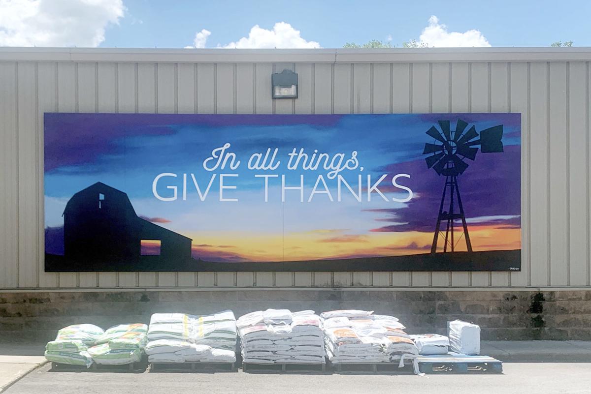 The finished 'Give Thanks' mural on the back wall of the Remington IGA store. Staff photo Heather VanDemark