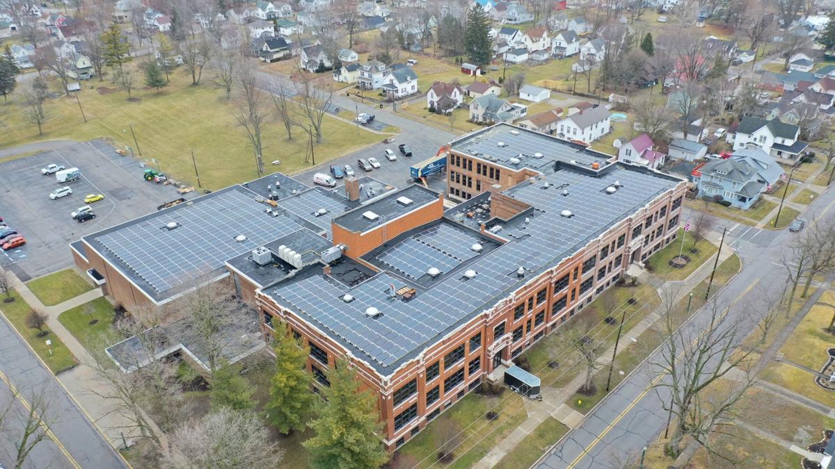 This drone shot captured in March show the nearly complete solar panel project on top of the Community Learning center, just one of several organization that have adopted renewable energy. Provide image