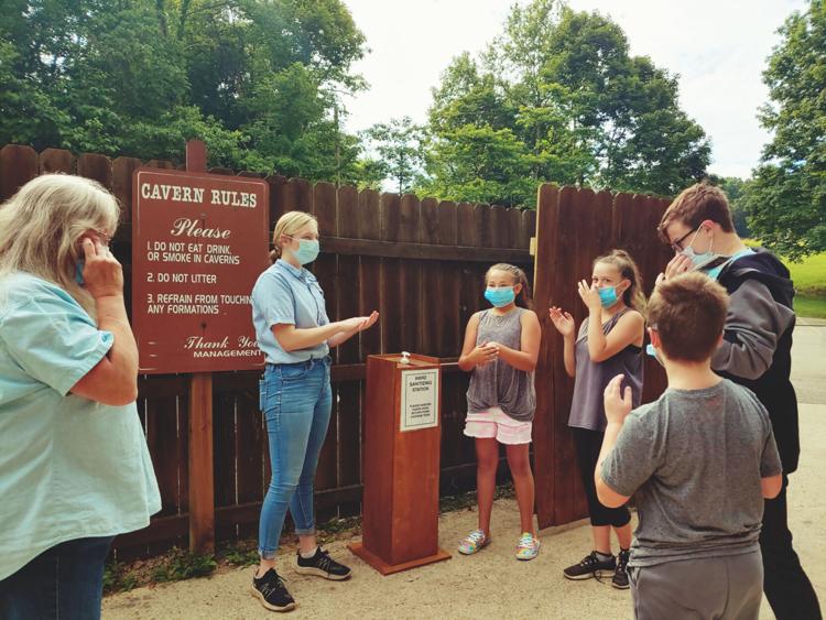 Grace Bohnenkamp, center, prepares to lead a tour through Bluespring Caverns. The tourism industry took a hard hit, thanks to the COVID-19 pandemic. Director of Lawrence County Tourism Tonya Chastain estimates tourism is down 36-38% throughout the state. (Lawrence County Tourism / Courtesy photo)