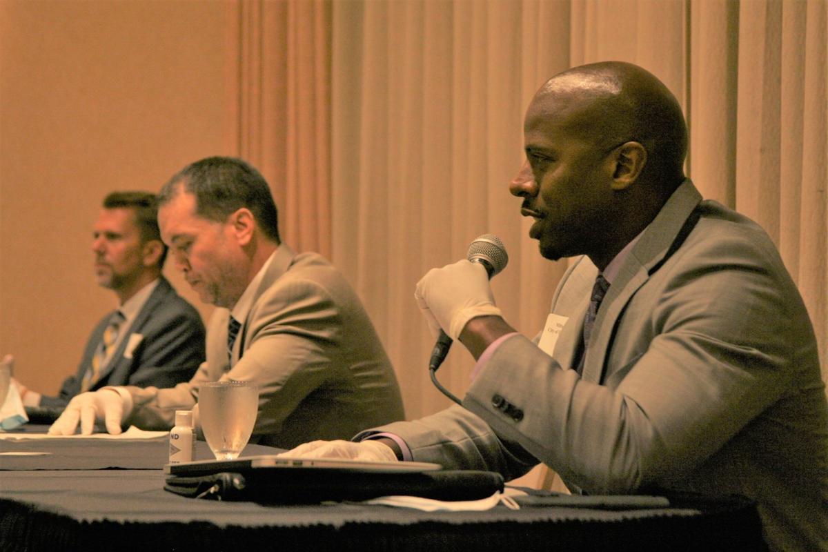 Milton Reed, right foreground, consultant to the city of Each Chicago, addresses the Lakeshore Chamber of Commerce Thursday at Dynasty Banquets in Hammond. Joining him on the panel to discuss Indiana’s assets to businesses are Phil Taillon, chief of staff for the city of Hammond, and Pete Novak, CEO of the Greater Northwest Indiana Association of Realtors. Steve Euvino, The Times