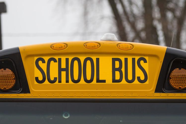 A school bus parked at the Tutt Branch Library providing Wi-Fi for students in South Bend. The white disc provides the signal for students to connect to. South Bend Tribune File Photo/MICHAEL CATERINA