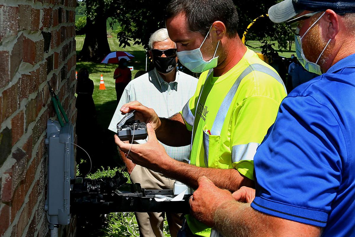 Smithville connected its first customer in the Sharpsville area with fiber-based internet on Thursday. Daniel Davis and Josh Hunley, install/repair techs with Smithville, connect the cable into the home of the Baird Family Farm. Photo by Tim Bath | Kokomo Tribune