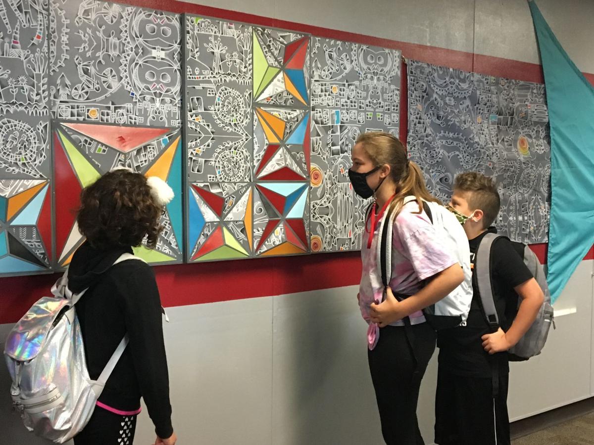 Coulston Elementary School students in Shelbyville check out a commissioned 32-foot mural created by artist Christ Zeibarth through local funding with Indianapolis-based Arts For Learning. Submitted photo