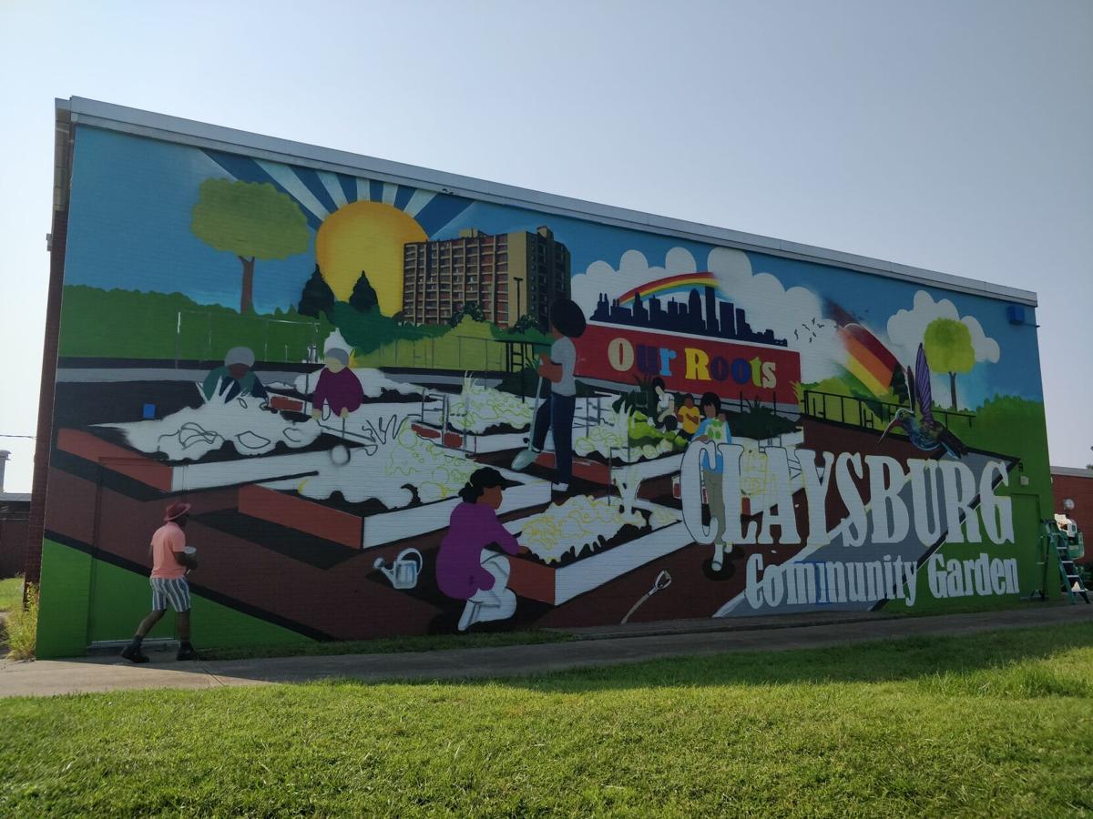 The nearly finished mural was designed by Louisville-based artist Kacy Jackson through inspiration form Claysburg residents. Staff photo by Aprile Rickert