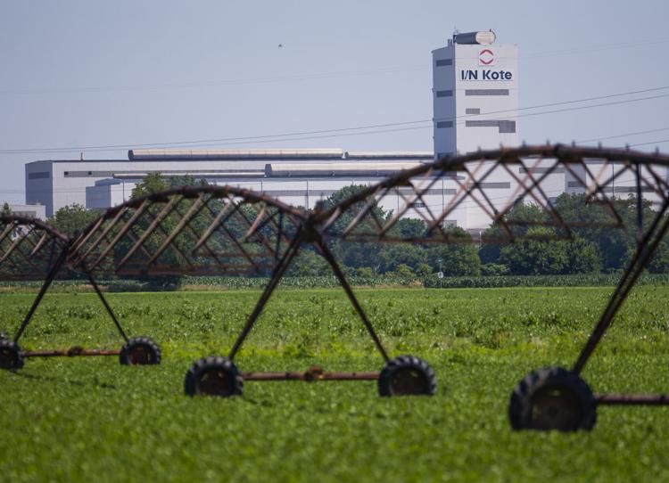 Farm irrigation equipment is shown not far from an industrial facility near New Carlisle in July. 2020. Tribune File Photo/MICHAEL CATERINA